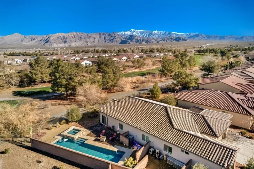 Aerial view of a home with a backyard pool
