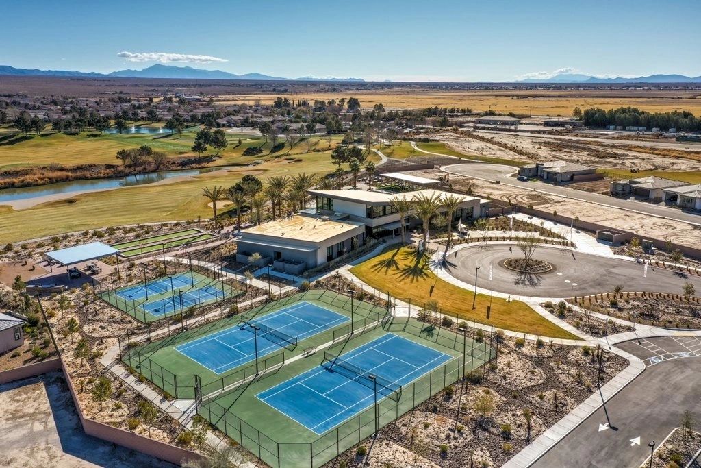 Aerial view of tennis courts and a community building